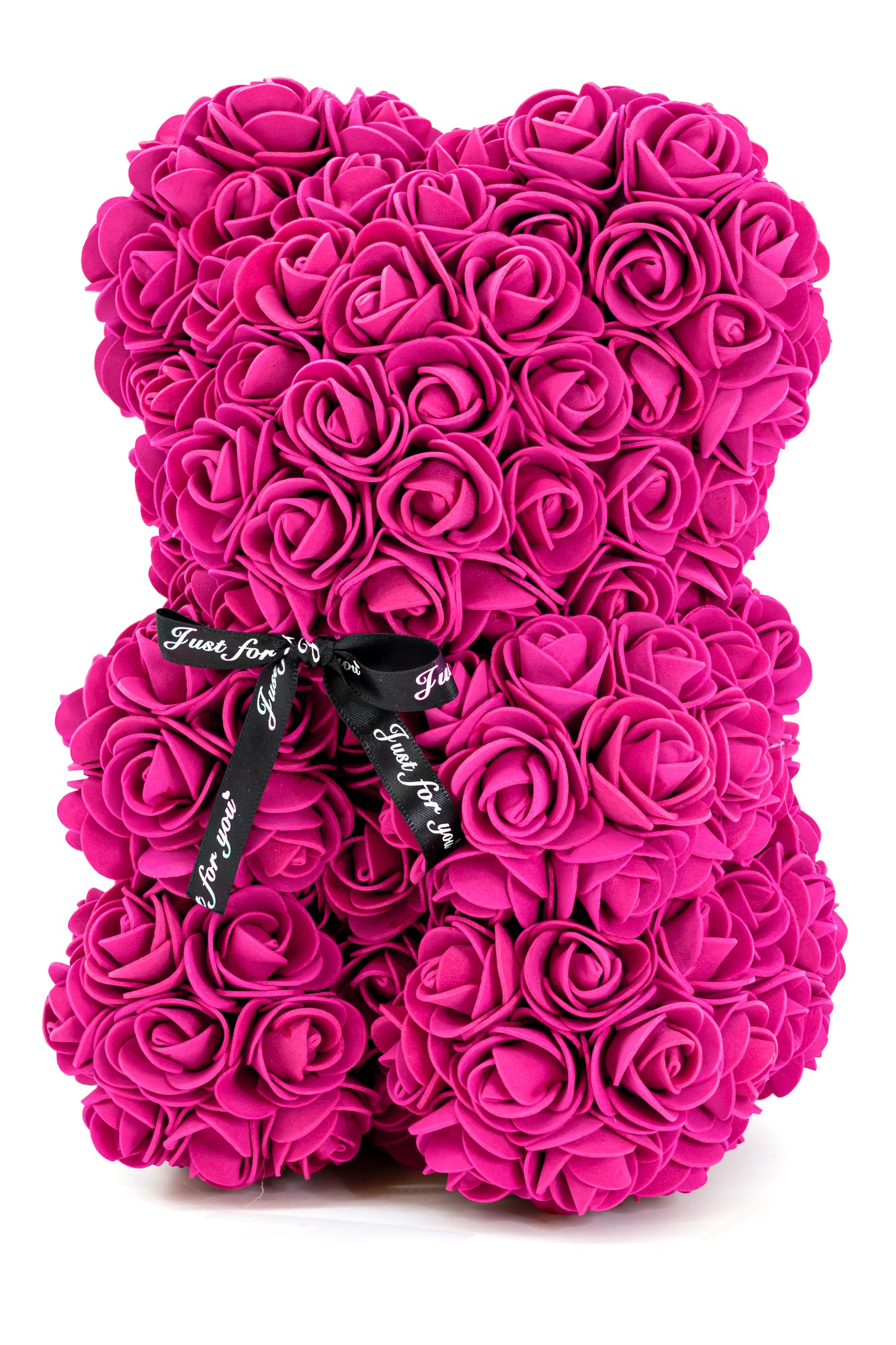 A bear shape decorative piece covered in rose color foam flowers. With a black bow ribbon around underneath the head.