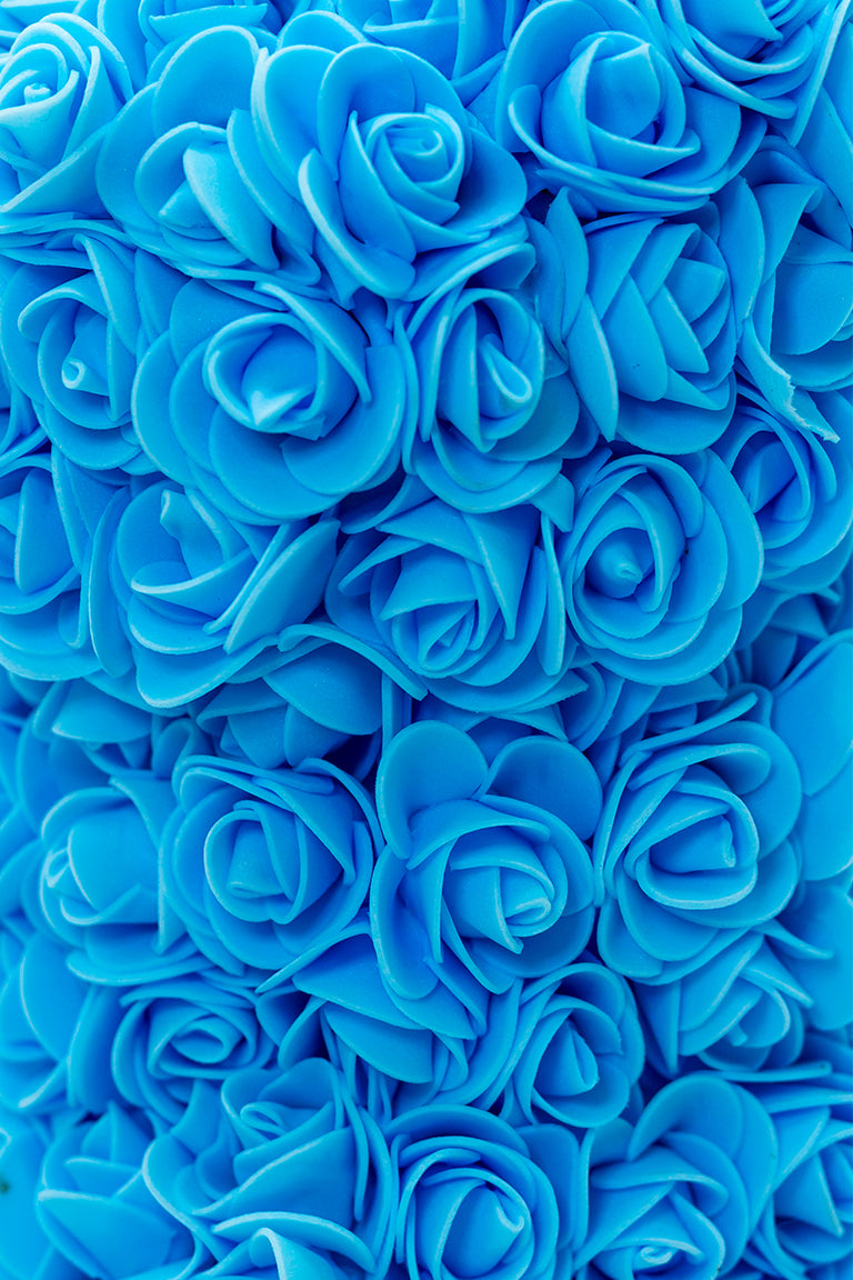 A close up shot of blue foam shaped roses