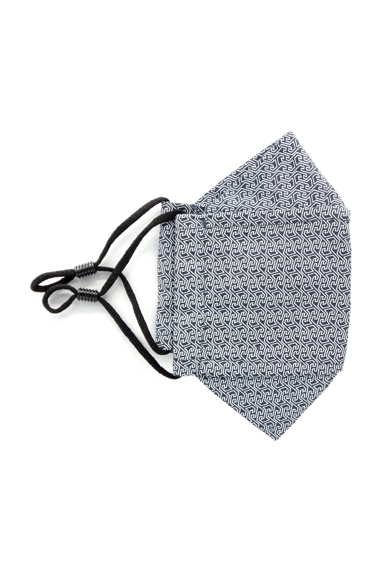 A gray colored adjustable face mask with white dot pattern made in Turkey