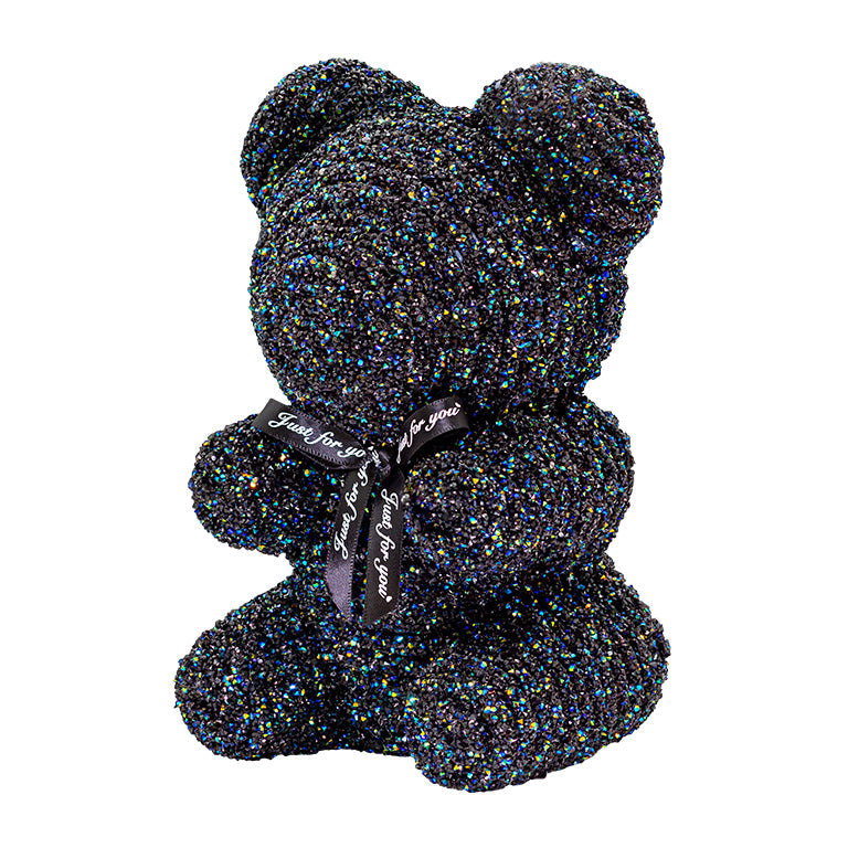 A decorative bear with black plastic glitter covered around the styrofoam bear.