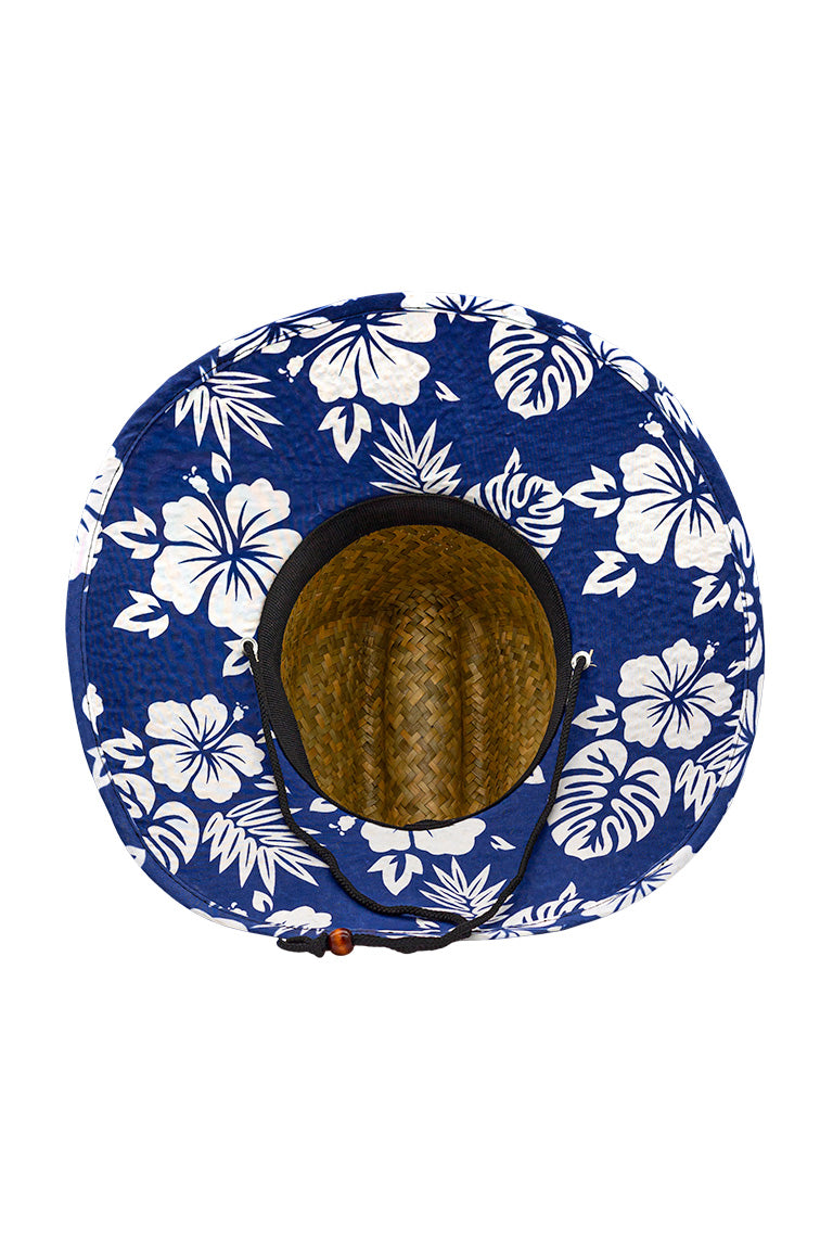 Bottom view of a straw hat with design pattern underneath the hat that provides shade. Has white floral images scattered across a blue background.