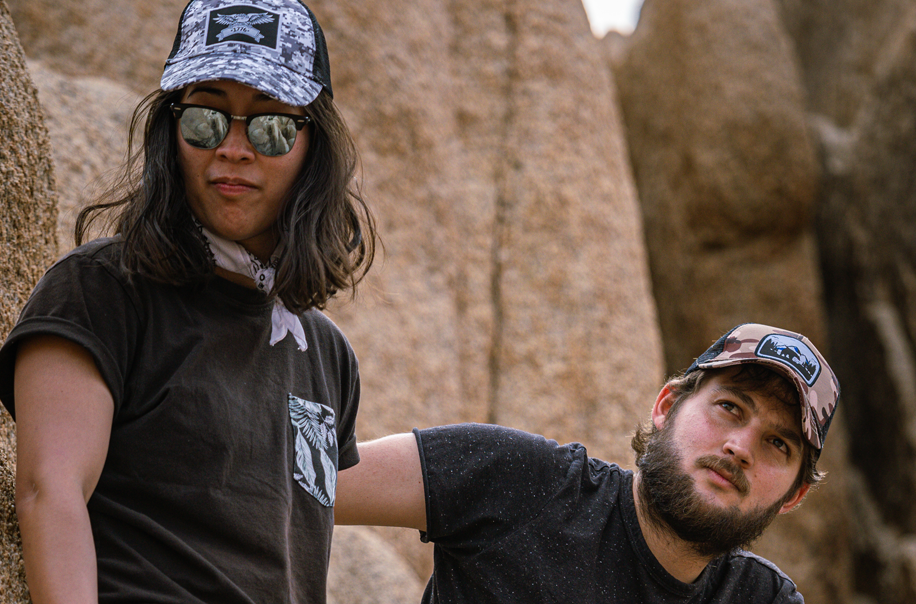 Two models out hiking wearing Chillmeister hats