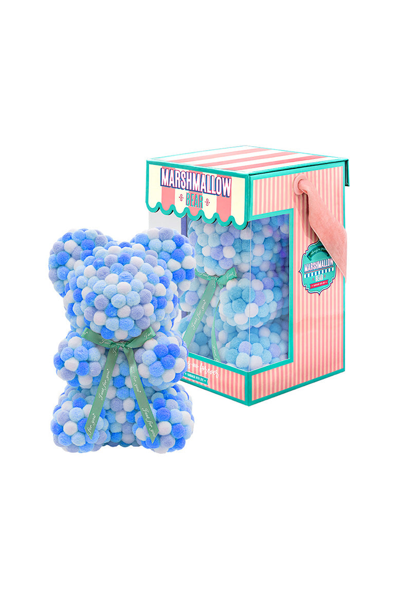 Various color of blue. Bear shape ornament covered in tiny foam balls with product packaging in the back