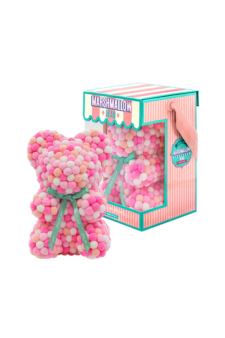 Various color of pink. Bear shape ornament covered in tiny foam balls with product packaging in the back