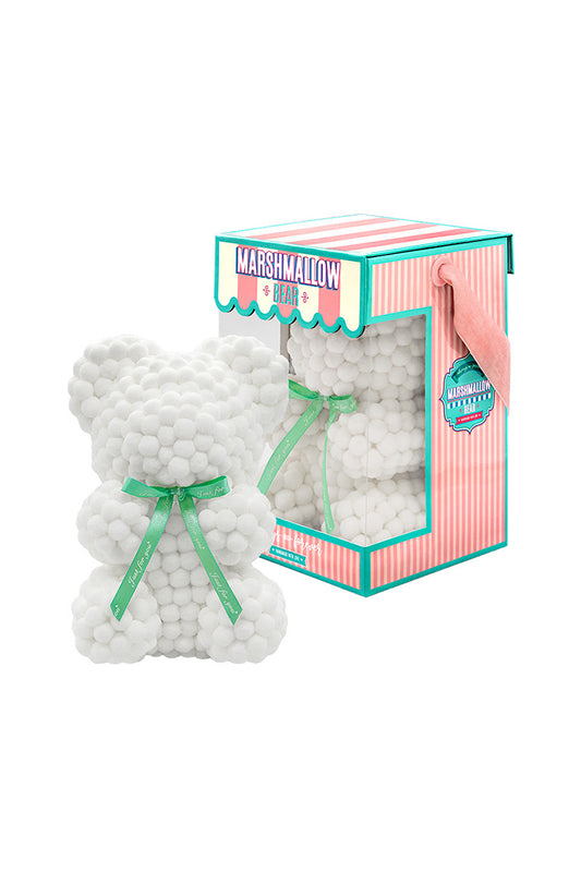 A white bear shape ornament covered in tiny foam balls with product packaging in the back