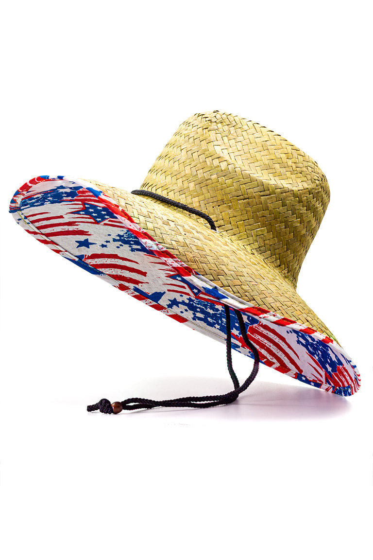 Side view of a straw hat with a American flag design pattern underneath the shaded visor with ablack chin strap