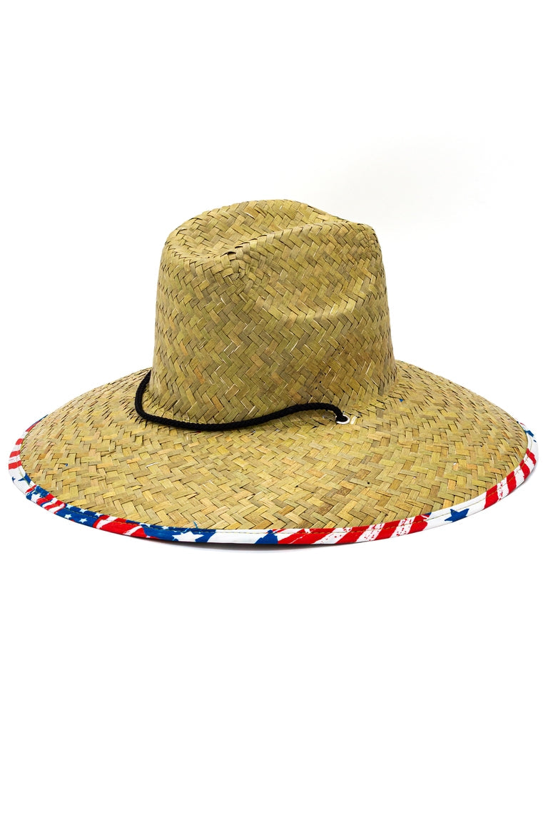 Top view of a straw hat with a American flag design pattern underneath the shaded visor with ablack chin strap