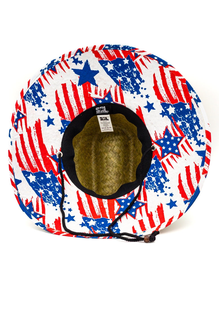 Bottom view of a straw hat with a American flag design pattern underneath the shaded visor with ablack chin strap