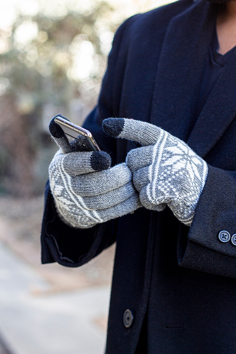 Model using hands to showing touchscreen gloves while interacting with phone 