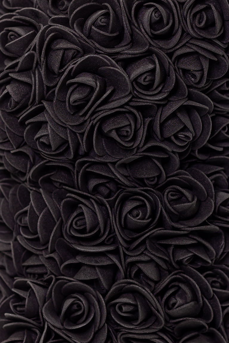 A close up shot of black foam shaped roses