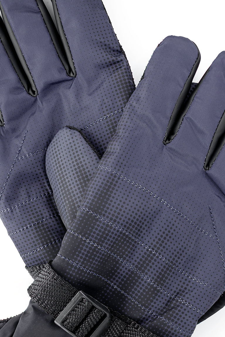 Close up of the heavy gloves colored as a gradient from gray to black. The black goes from solid around the cuff to a dotted pattern towards the finger tips