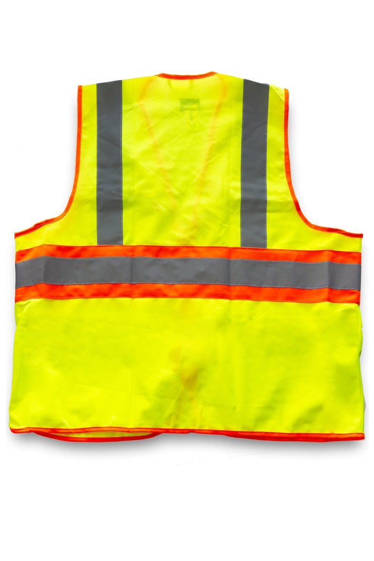 Back side of a yellow with orange stripe safety vest. Has reflective bands.