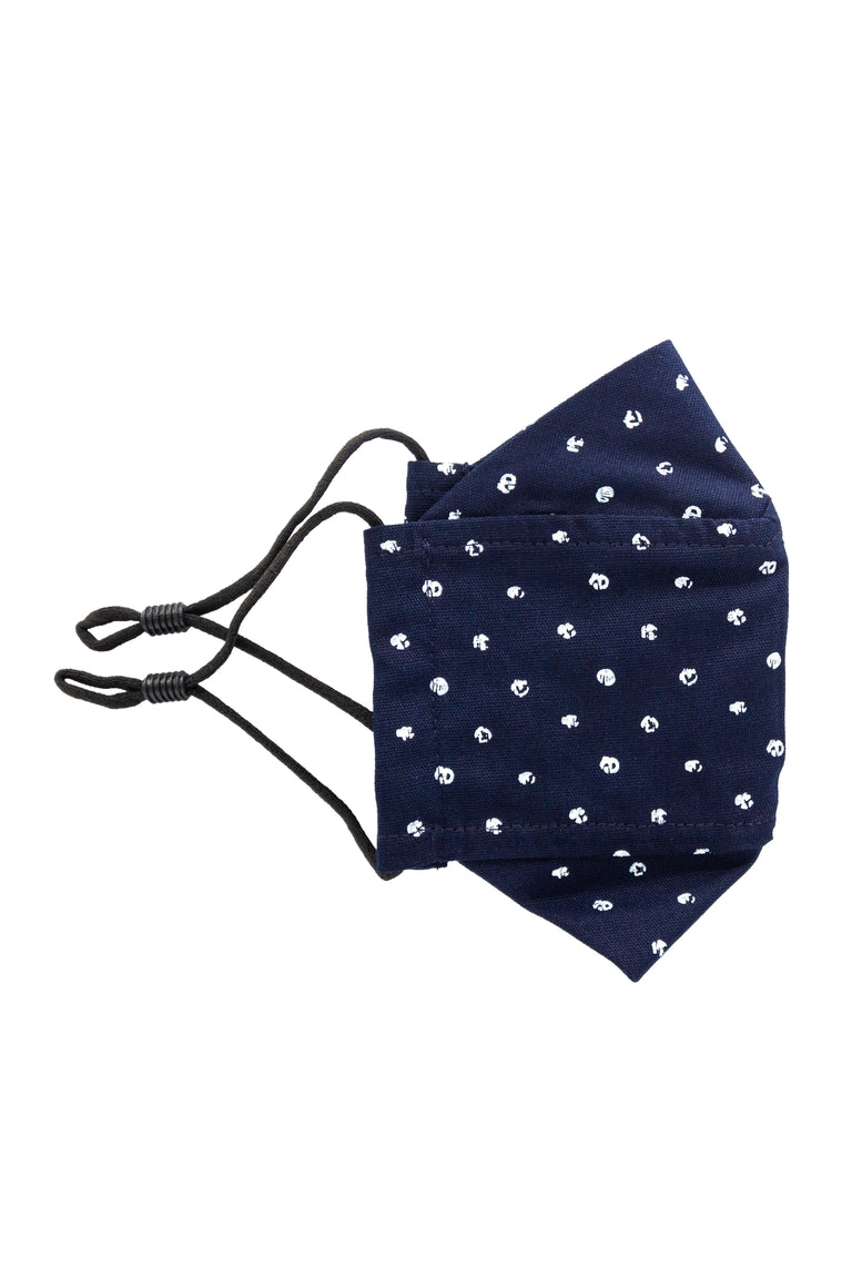 A navy colored adjustable face mask with white dot pattern made in Turkey