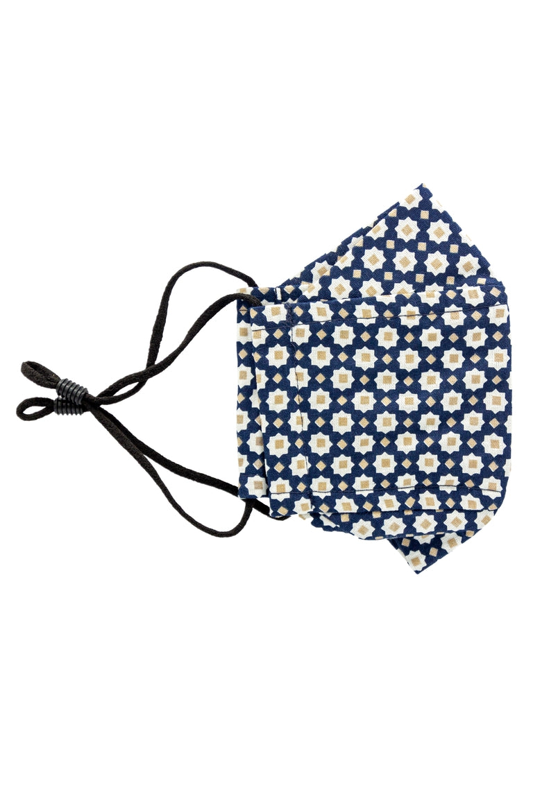 A navy colored adjustable face mask with white and yellow star shape pattern made in Turkey