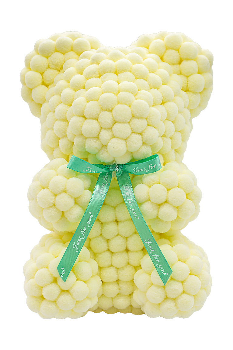 A yellow bear shape ornament covered in tiny foam balls