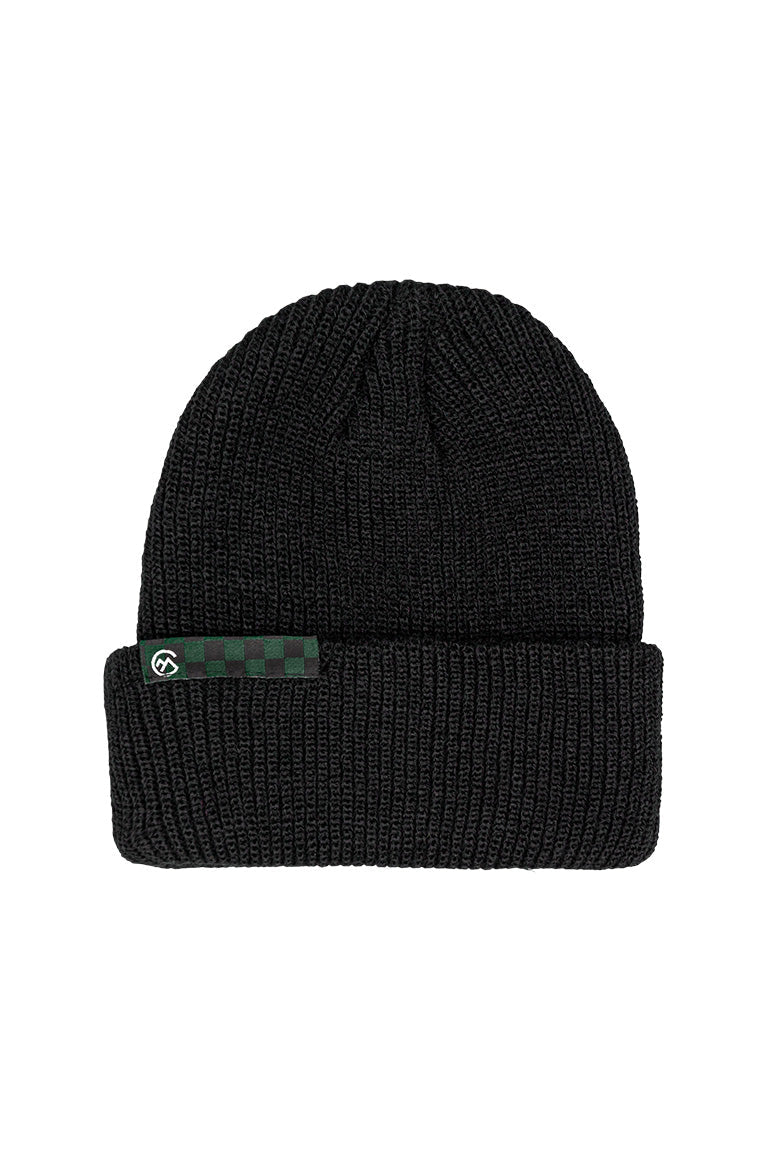 A black beanie with a small tag of a black and green checkered design