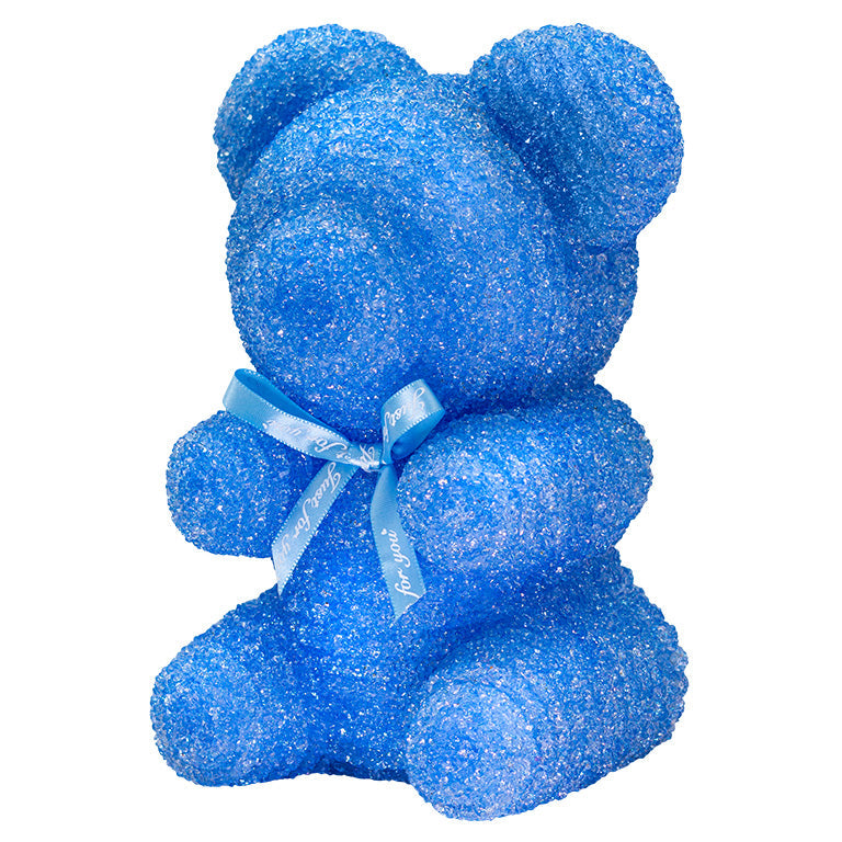 A decorative bear with light blue plastic glitter covered around the styrofoam bear. 