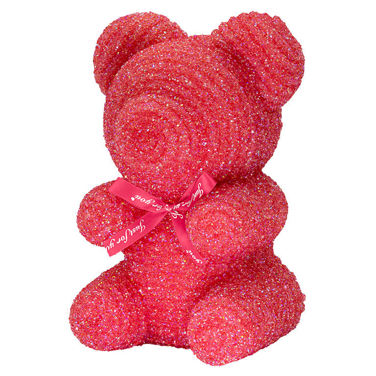 A decorative bear with darker red plastic glitter covered around the styrofoam bear. 