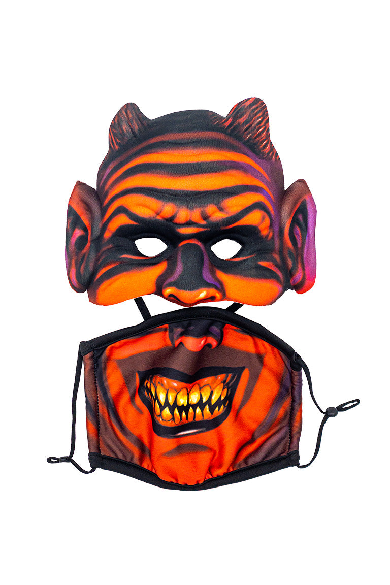 A 2 piece face mask of an demon design. One piece to cover the eyes and nose. The other separate piece to cover the mouth.