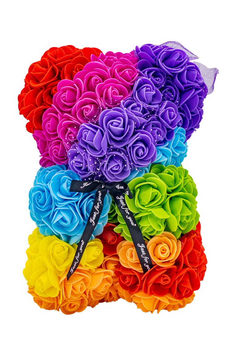 A flower bear decoration cover in foam roses making a rianbow color pattern