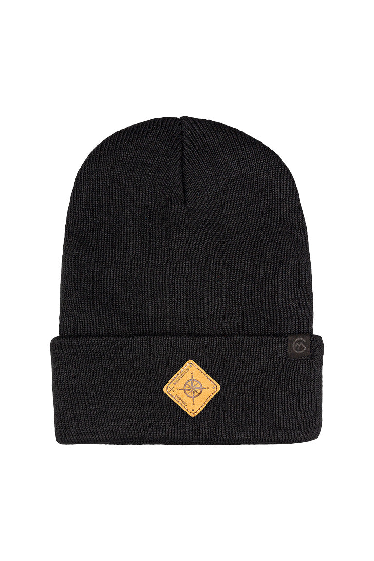 A black beanie with a small diamond shape patch of a compass design