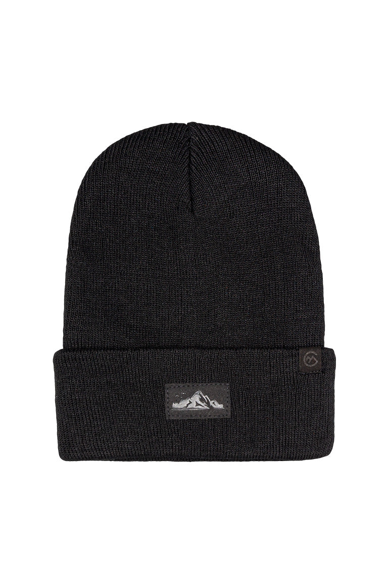 A black beanie with a small square patch of a black and white mountain design