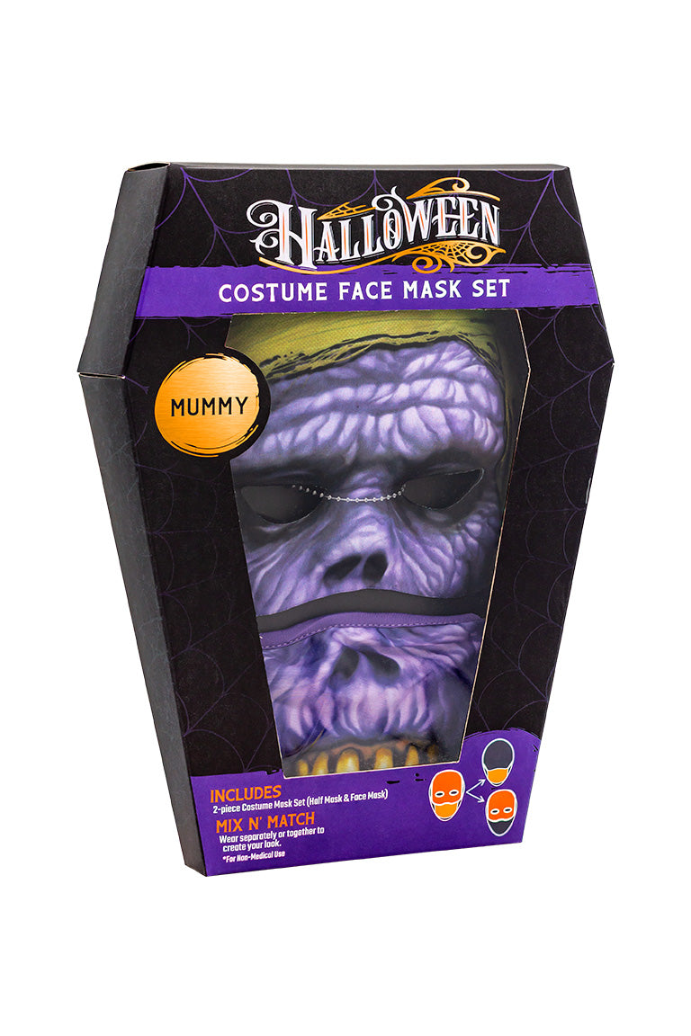 A 2 piece face mask of an mummy design. One piece to cover the eyes and nose. The other separate piece to cover the mouth inside a coffin shaped packaging box.
