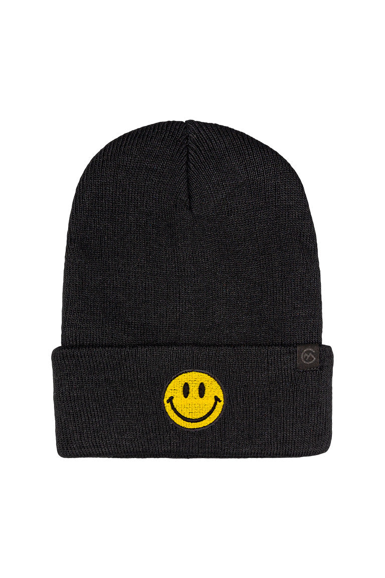 A black beanie with a patch of a yellow smiley face