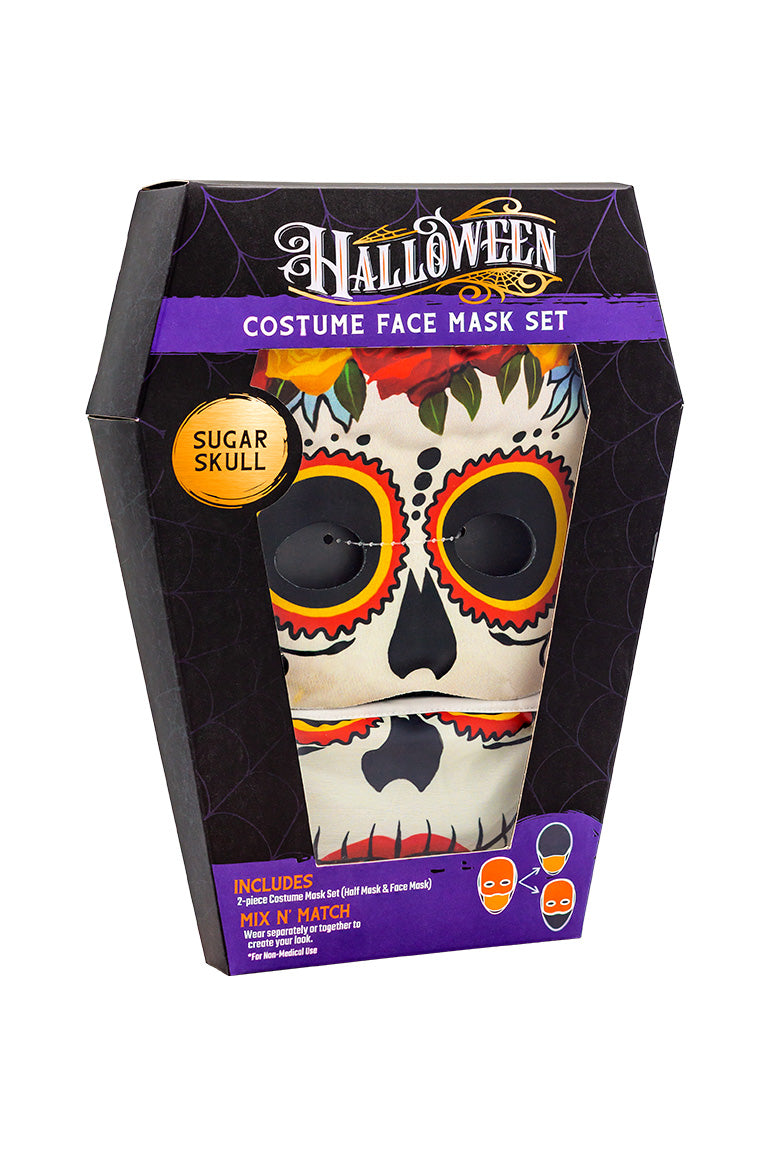 A 2 piece face mask of an sugar skull design. One piece to cover the eyes and nose. The other separate piece to cover the mouth inside a coffin shaped packaging box.