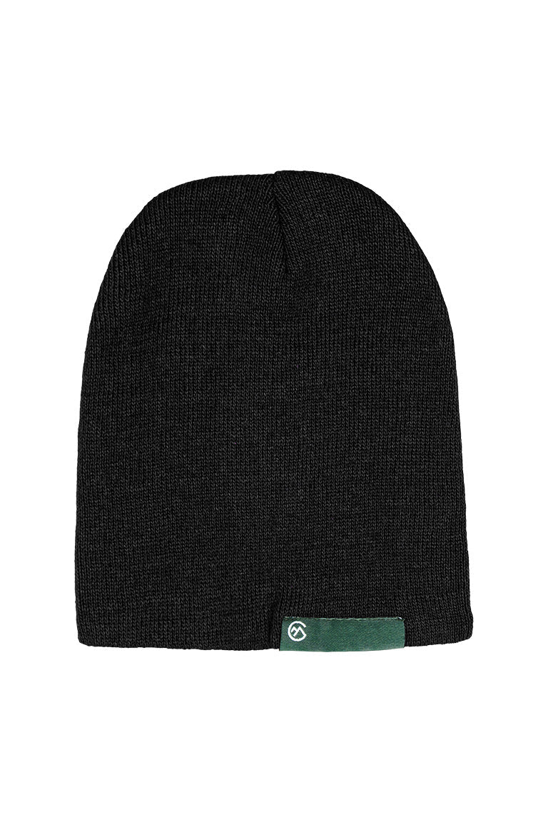 A black beanie with a green small rectangle tag at the base of the cap