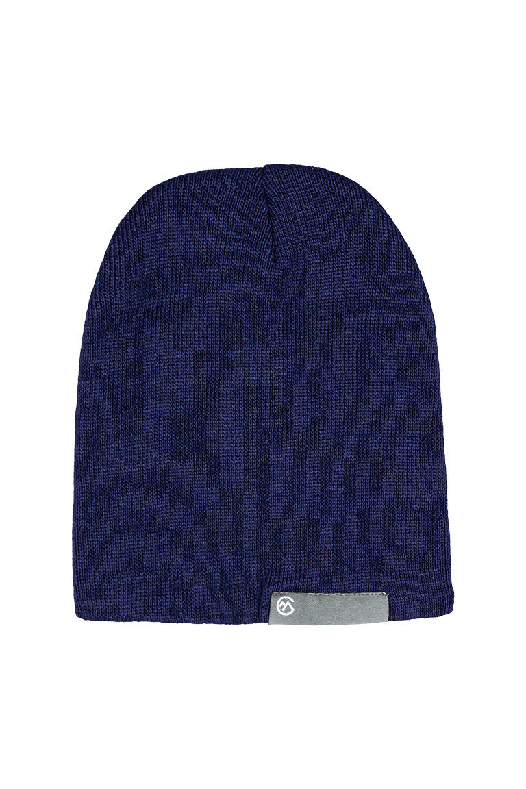A navy beanie with a gray small rectangle tag at the base of the cap